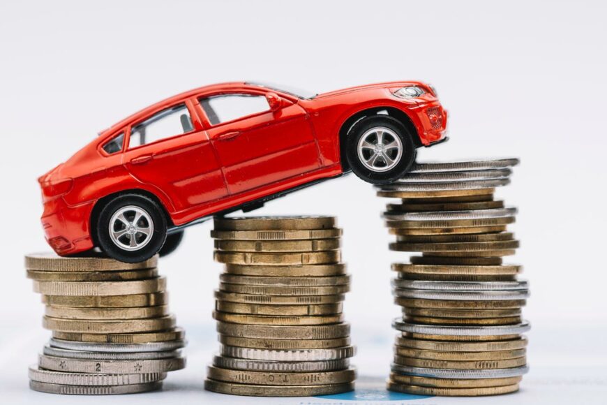 toy red car stack increasing coins against white background ТОП-8 вопросов-ответов по налогу на транспорт