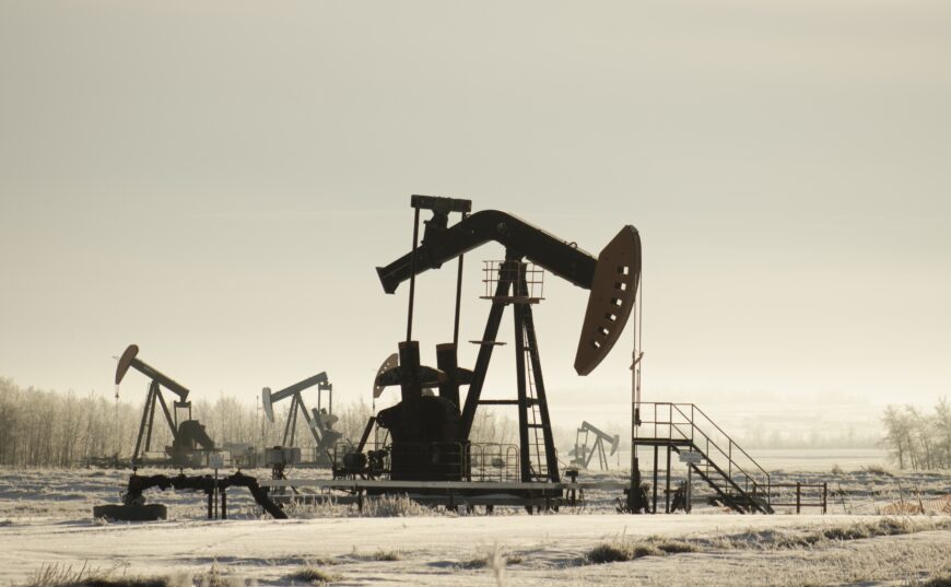 field with oil pump jacks surrounded by greenery sunlight Казахстан планирует добыть 85,7 млн тонн нефти в 2021 году